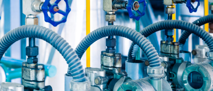 steel pipelines and cables in a plant